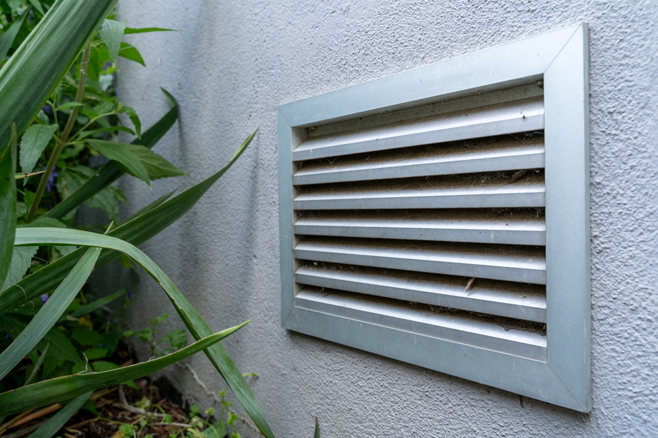 Dryer ventilation on the outside facade of a house